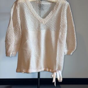 Very light pink, cashmere v-neck sweater